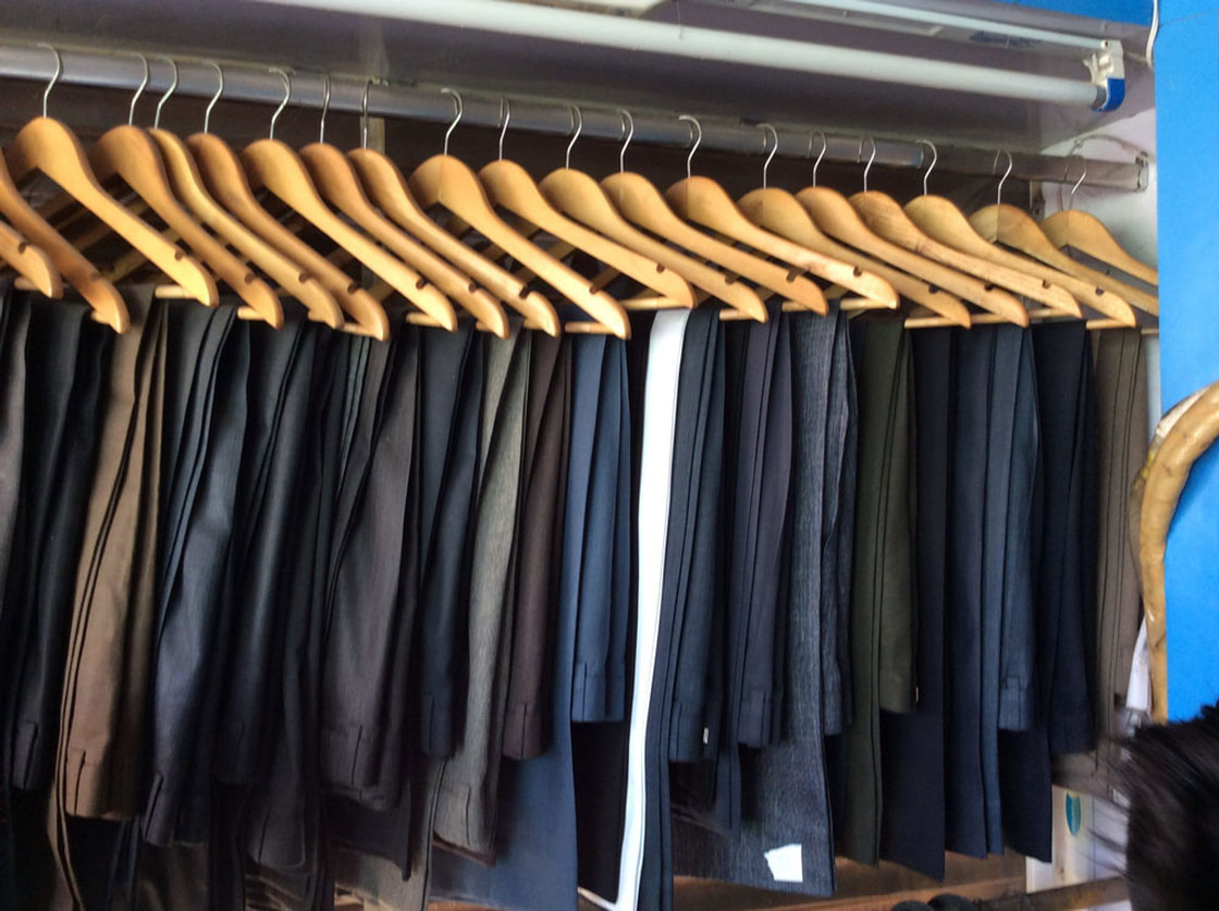 Freshly cleaned suit pants, dry cleaned by R&R Fabricare